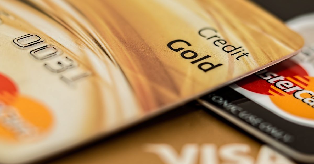 africa cybersecurity centre - Stack of various branded credit cards focusing on gold card showing finance and cashless concep