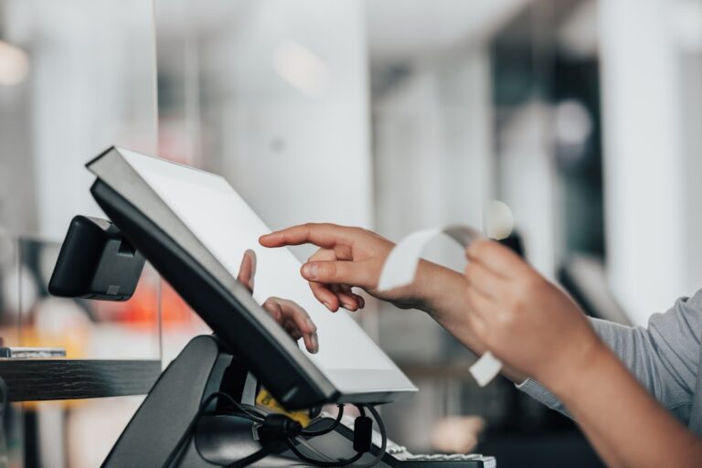 ai agents pay - a person is using a pos machine in a store