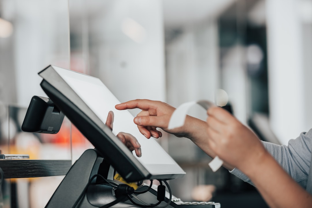ai agents pay - a person is using a pos machine in a store