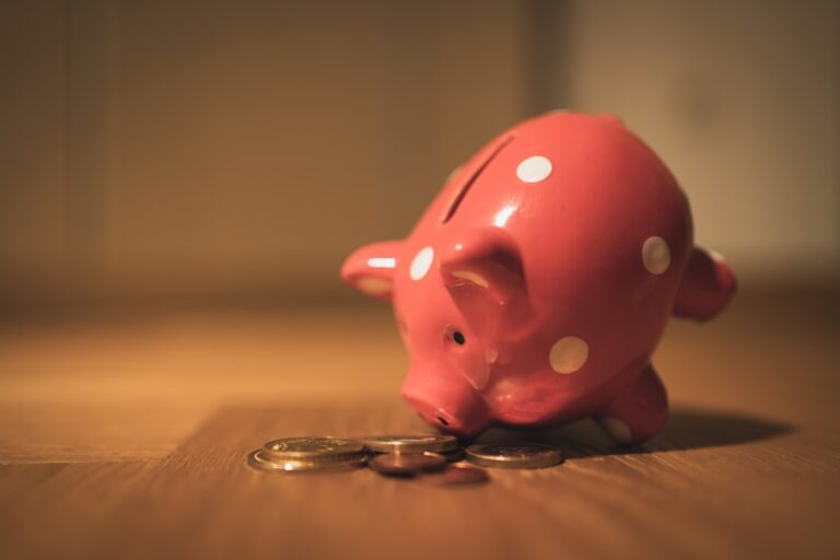ai startup lifeline - pink pig coin bank on brown wooden table