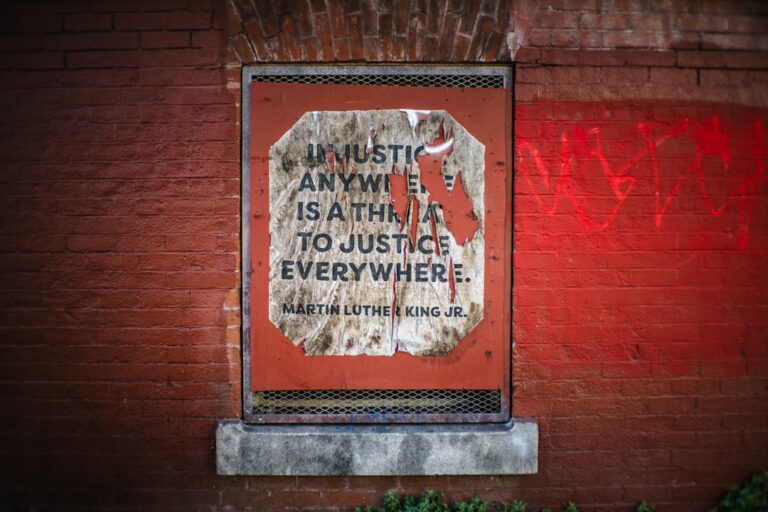 natwest ai ethics - Quote about justice on a weathered brick wall.