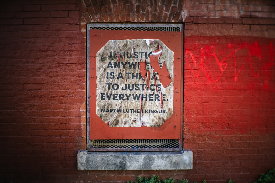 natwest ai ethics - Quote about justice on a weathered brick wall.