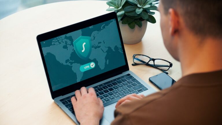 ai fraud detection - person using macbook pro on white table