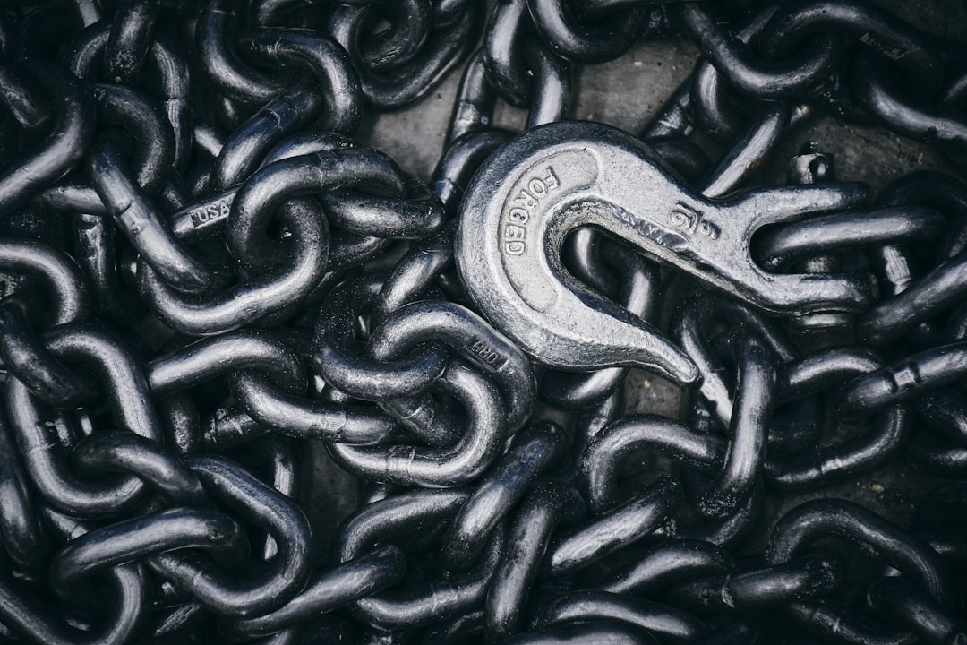 ai sustainable supply chains - A close up of a chain with a wrench on it