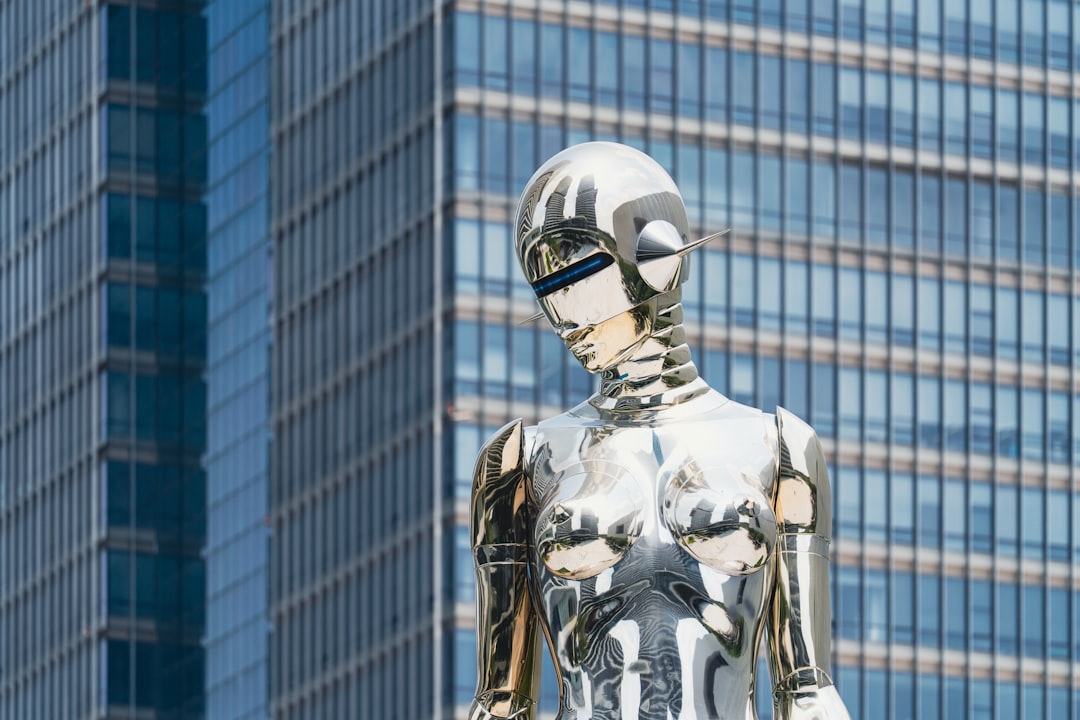 ai in banking - Shiny statue stands in front of a skyscraper.