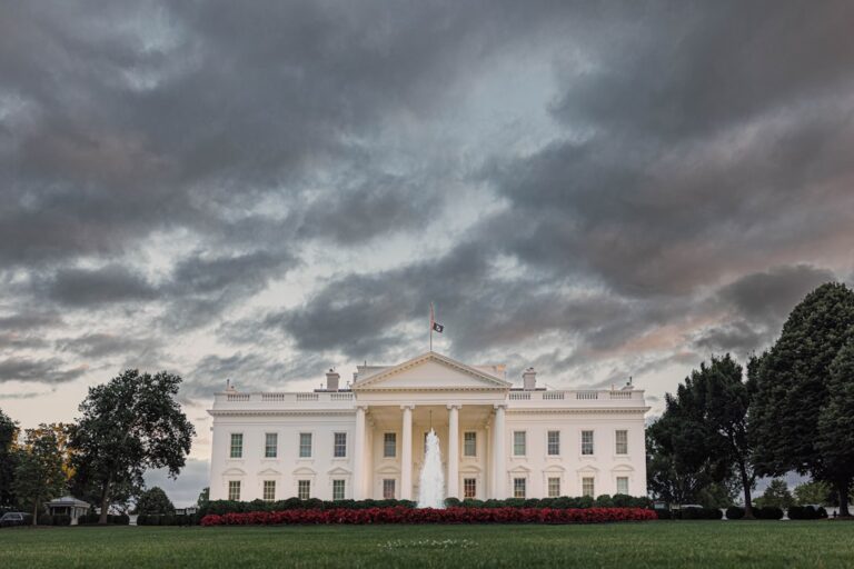 anthropic mythos ban - a white building with a fountain in front of it
