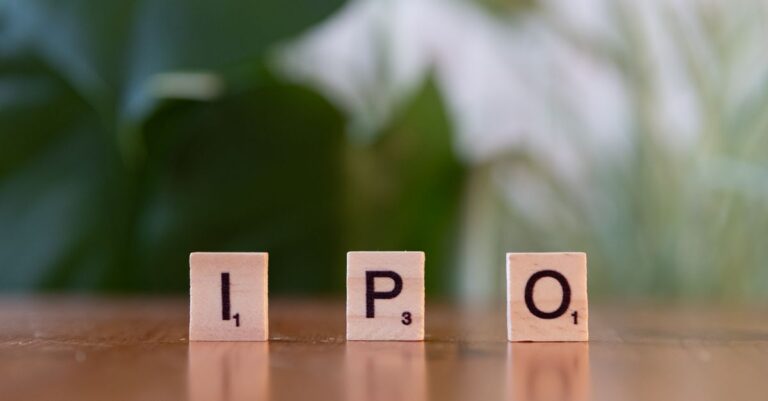 spacex ipo - Wooden letter blocks spelling IPO on a table, symbolizing investment opportunities.