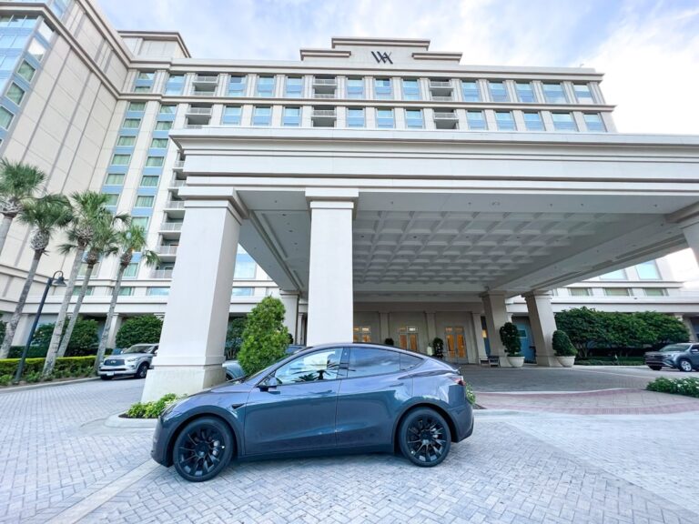 hertz shares plunge - a car parked in front of a building