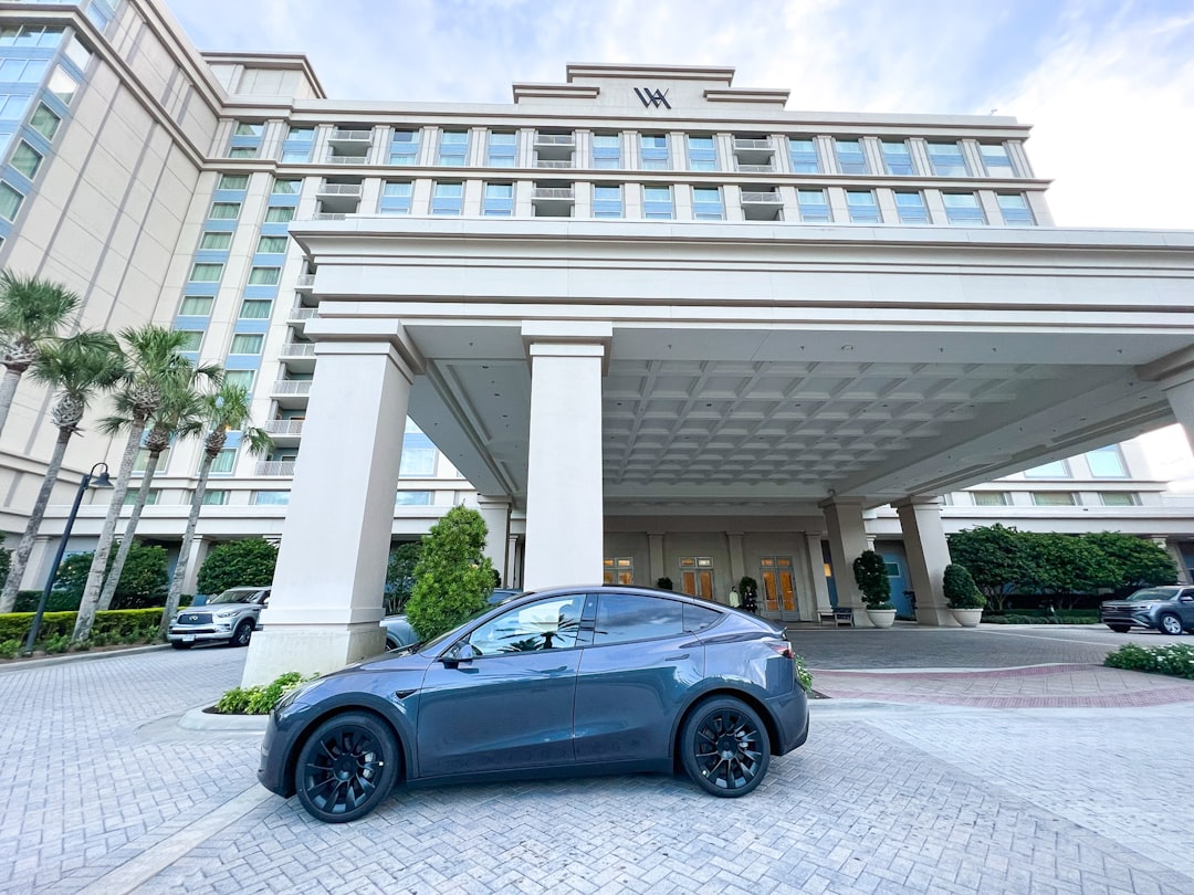 hertz shares plunge - a car parked in front of a building