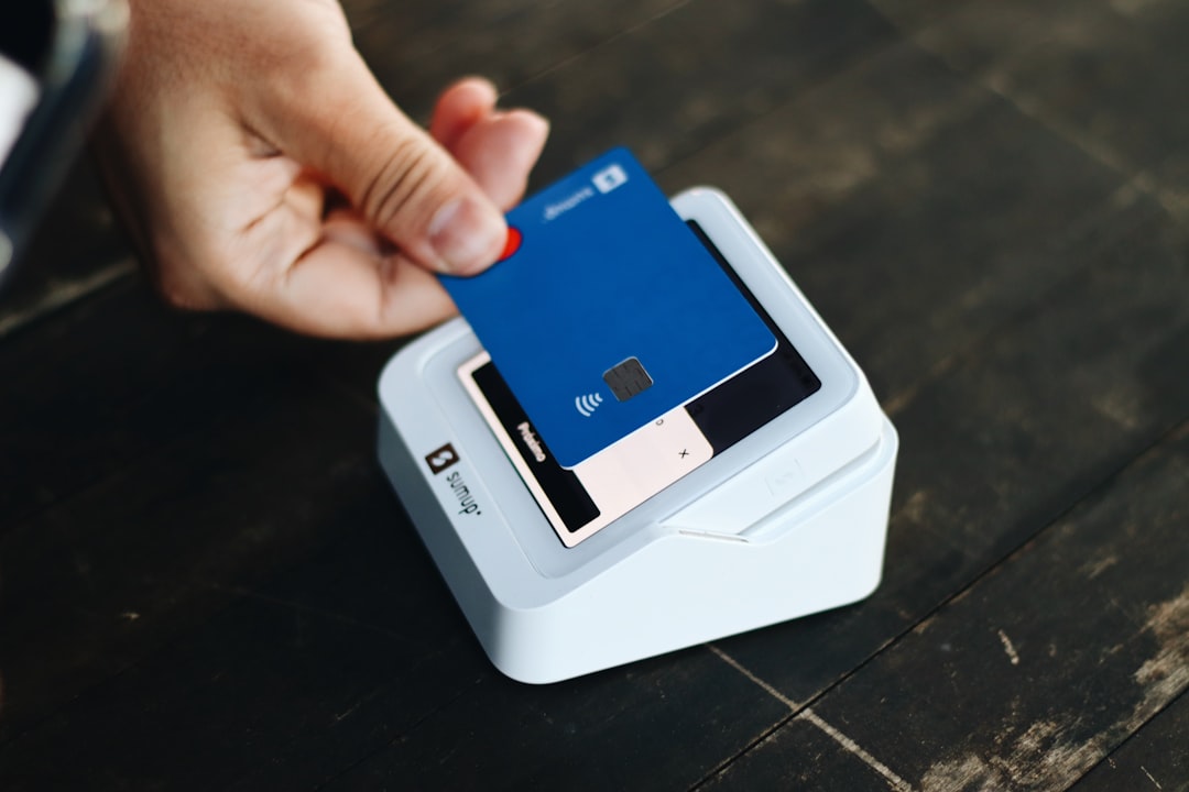 cash deposits digital accounts - a person holding a credit card in their hand