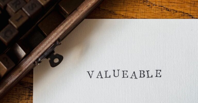 databricks valuation growth - A classic typewriter typing 'VALUEABLE' on a white sheet on a wooden table.