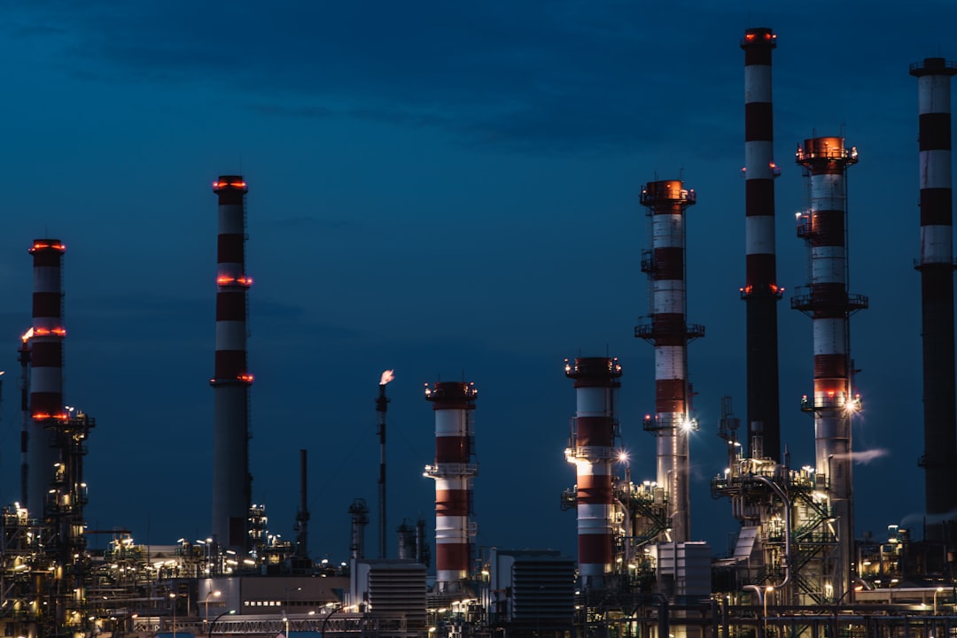 energy optimization software - red and white tower under blue sky during night time