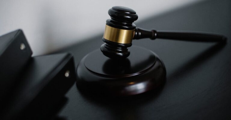 fca freezes securities - High angle of shiny wooden ceremonial mallet with golden detail placed on judge tale near documents