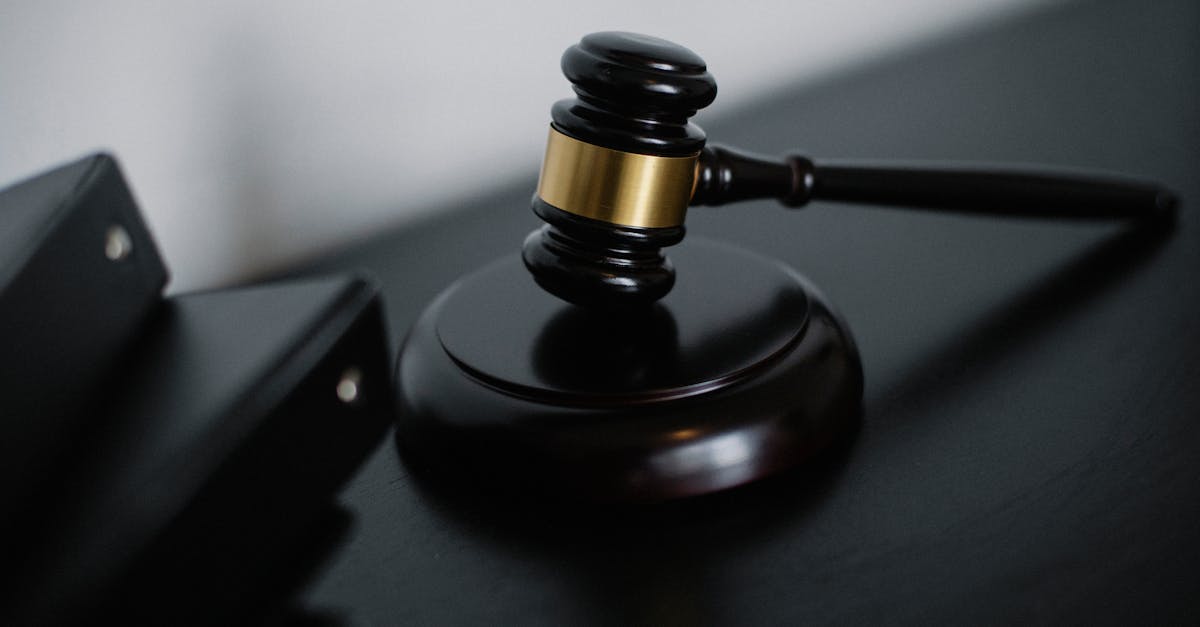 fca freezes securities - High angle of shiny wooden ceremonial mallet with golden detail placed on judge tale near documents