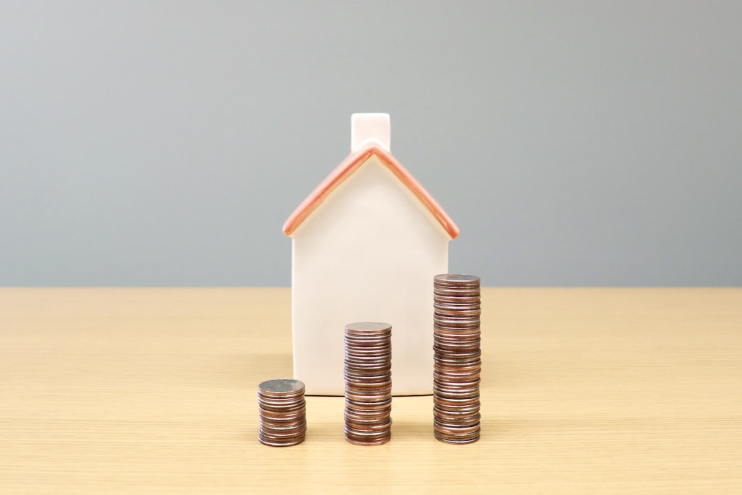fca mortgage reforms - a house and stacks of coins on a table