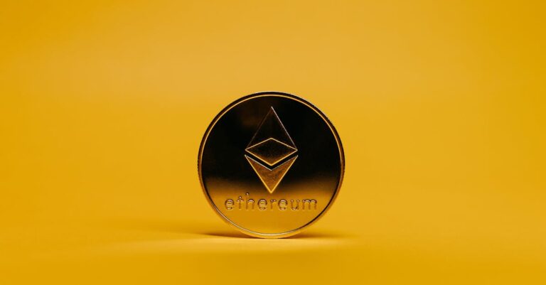 fdic stablecoin plan - A shiny Ethereum coin displayed on a vibrant yellow background, symbolizing cryptocurrency.