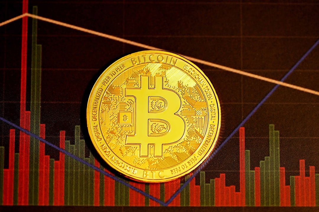 strategy shares fall - gold round coin on red and black textile