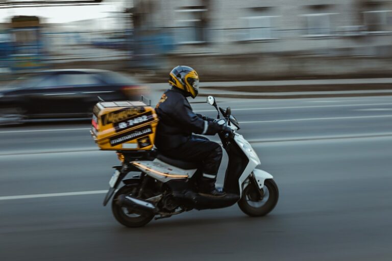 instant payments delivery - man in black jacket riding motorcycle