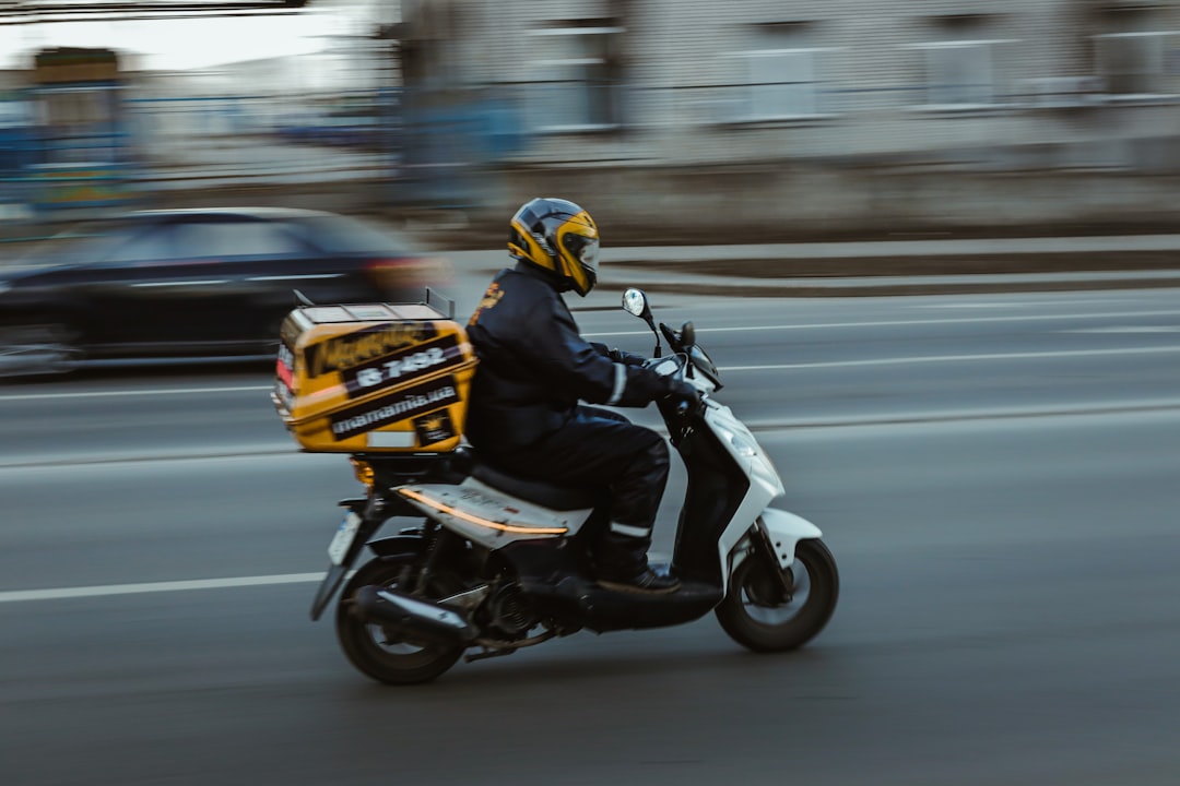 instant payments delivery - man in black jacket riding motorcycle