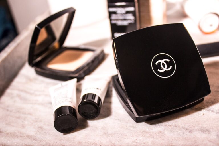 glossier secured credit - women's Chanel pressed powder beside tube bottles