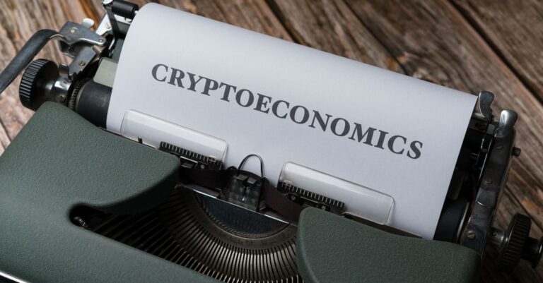 indonesia crypto rules - Cryptoeconomics typed on paper using vintage typewriter on wooden background.