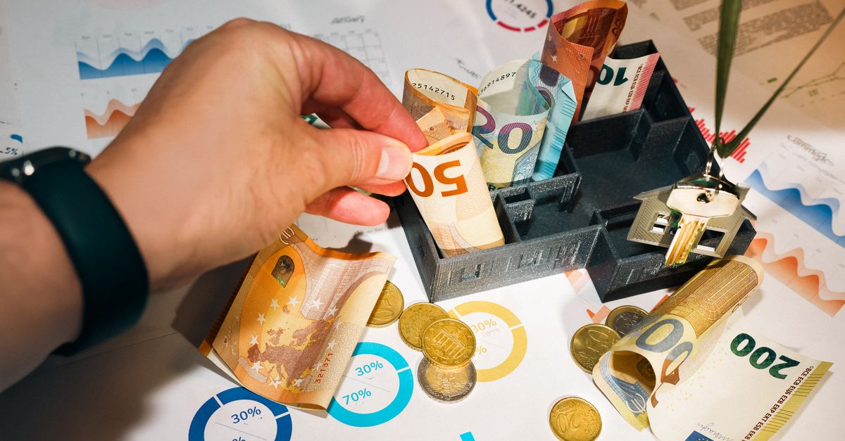 n26 full-year profitability - Euro bills and coins with financial charts showcasing budgeting and investment planning.