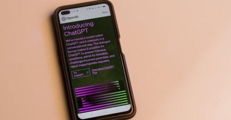 openai ipo filing - Smartphone screen showing ChatGPT introduction by OpenAI, showcasing AI technology.