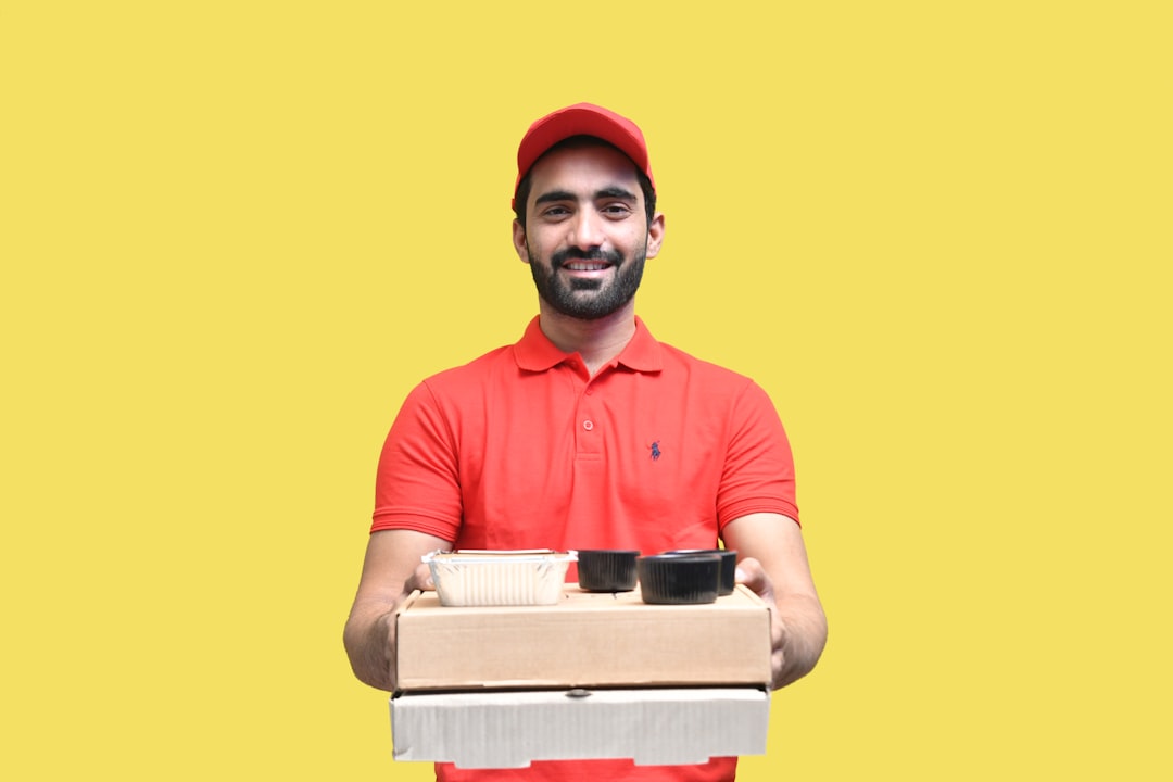 quick-commerce valuation - a man holding a stack of boxes
