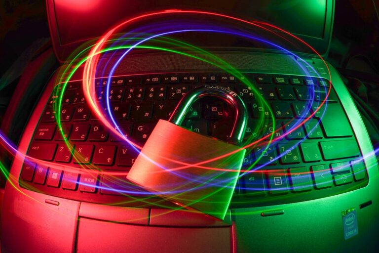 ransomware group warning - padlock on laptop with light trails