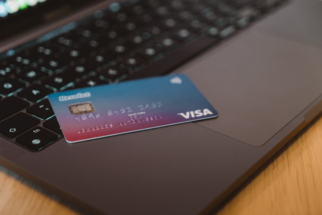 revolut product approvals - blue and white visa card on silver laptop computer