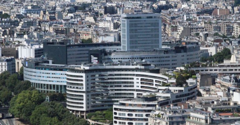 totalenergies climate risks - Aerial view of modern and historic architecture in central Paris, France.