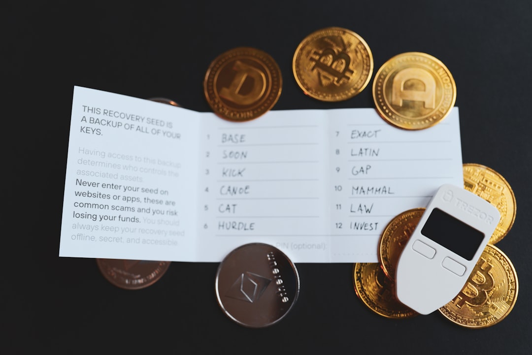 digital wallet - a cell phone sitting on top of a pile of coins