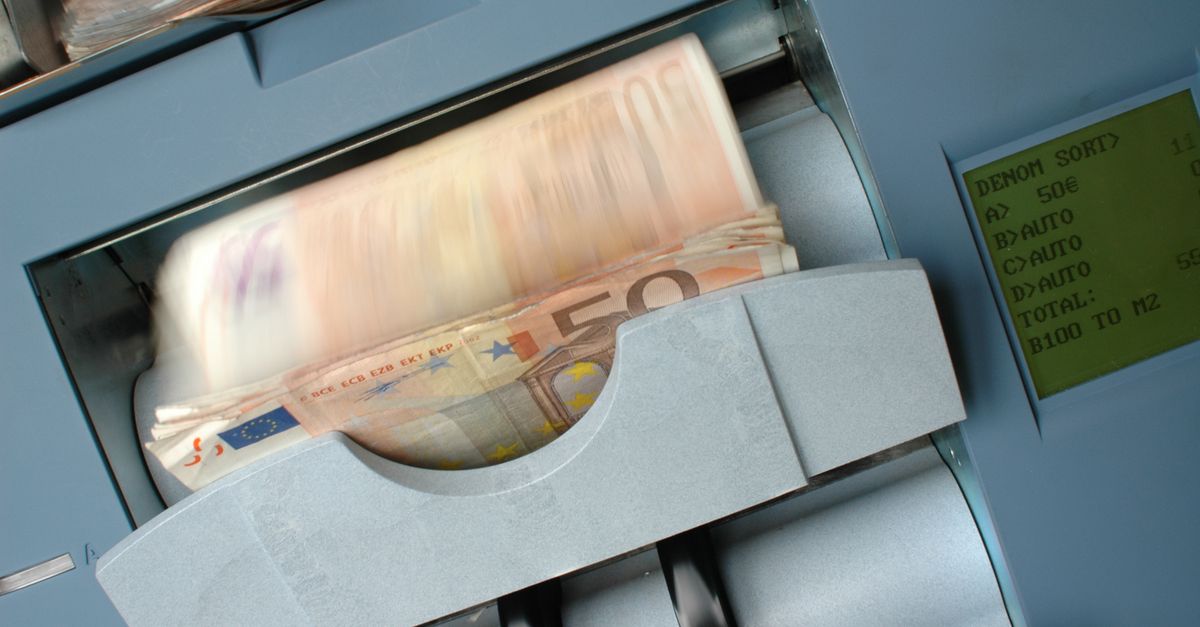 regtech compliance automation - 50 Euro banknotes being processed in a high-speed counting machine, showcasing technology and