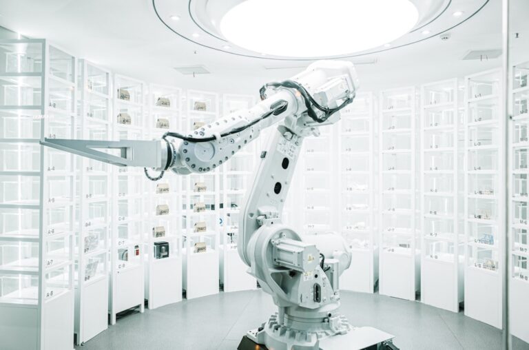 build hard tech - white robotic arm in display showroom