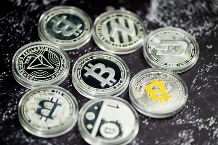 sec nms proposal - a pile of bitcoins sitting on top of a table