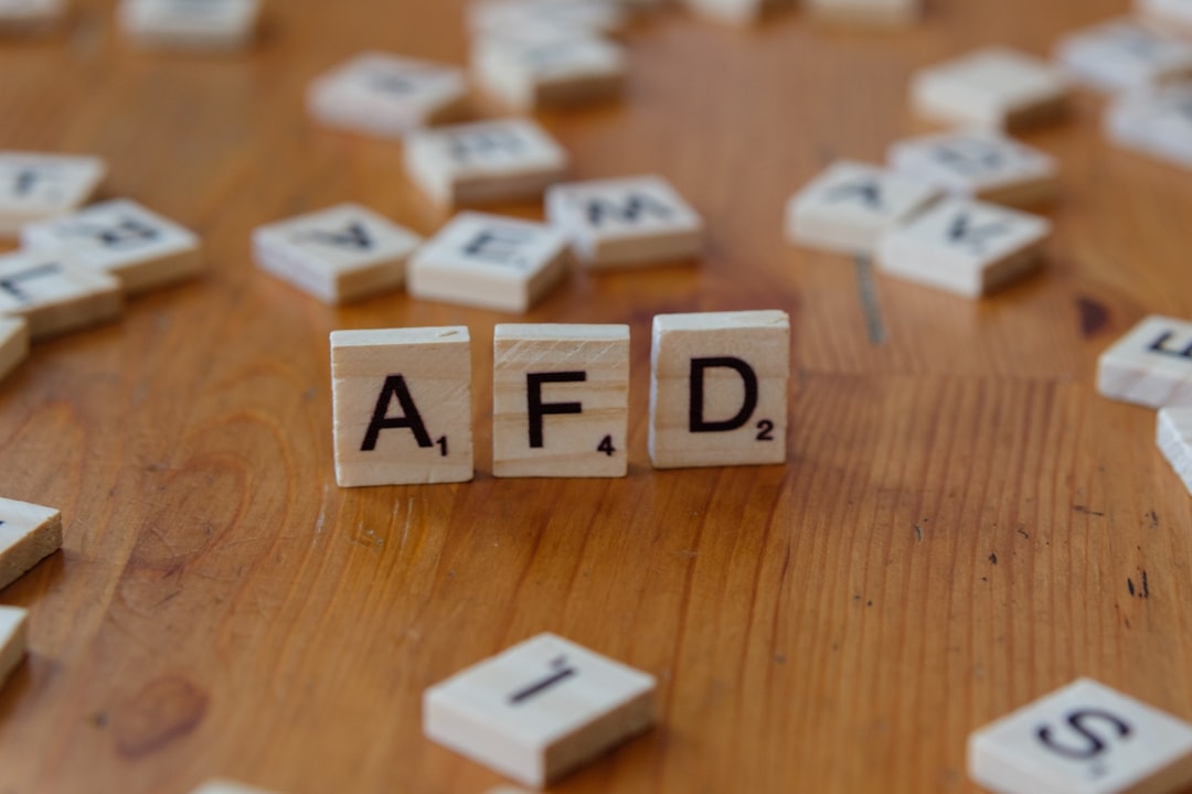 ai infrastructure investments - A wooden table topped with scrabble tiles spelling the word afd