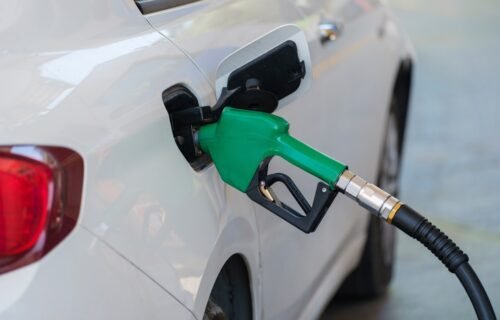 biofuel price surge - a white car with a green gas pump