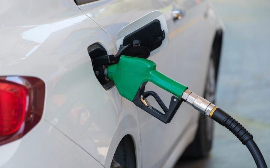 biofuel price surge - a white car with a green gas pump