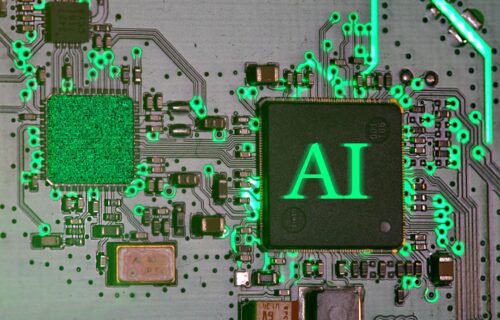 ai cyberattack enterprises - Glowing ai chip on a circuit board.