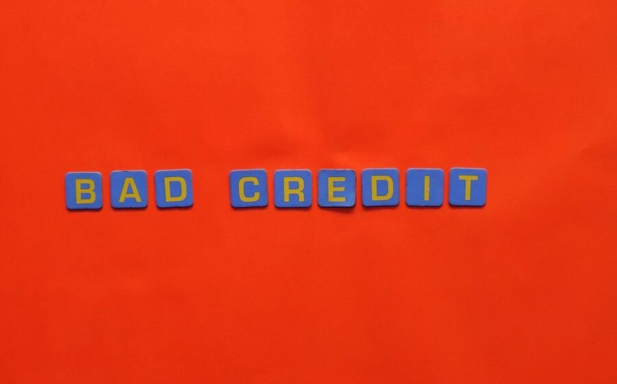 ai private credit - Blue letter blocks spelling 'Bad Credit' on an orange background.