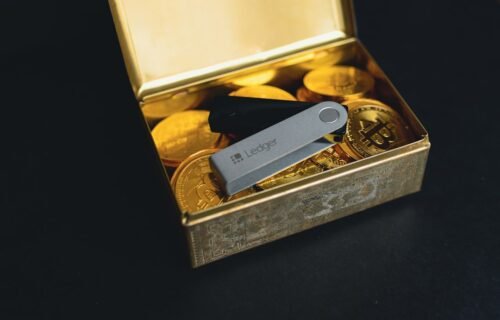 ledger rocket interview - a swiss army knife sitting in a box of gold coins