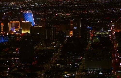 boring company funding - A captivating aerial view of Las Vegas' illuminated skyline at night, capturing its vibrant urban en