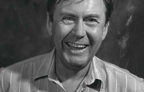 cfpb funding - a black and white photo of a man smiling