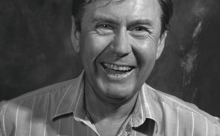 cfpb funding - a black and white photo of a man smiling