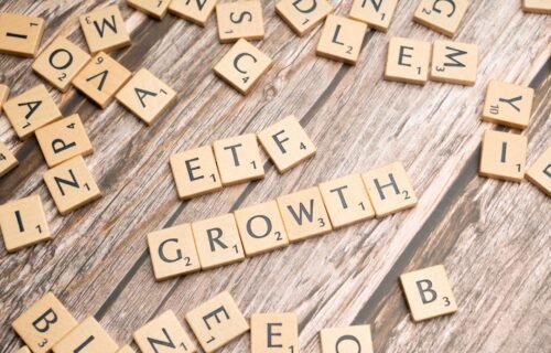 enova lending record - a group of scrabble tiles spelling the word growth