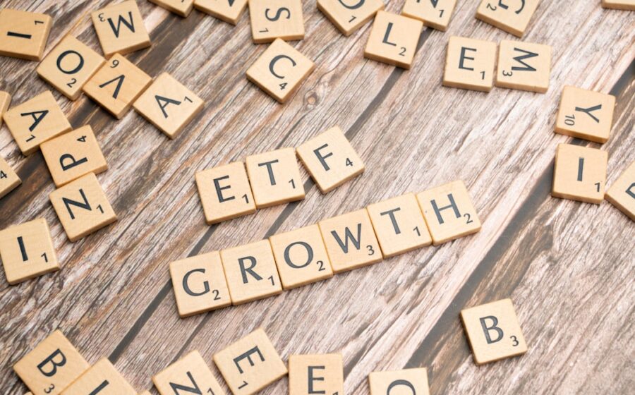 enova lending record - a group of scrabble tiles spelling the word growth