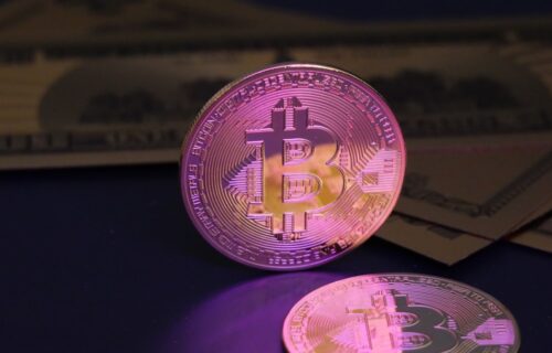 dollar stablecoins fx - Bitcoin coin and us dollar bills.