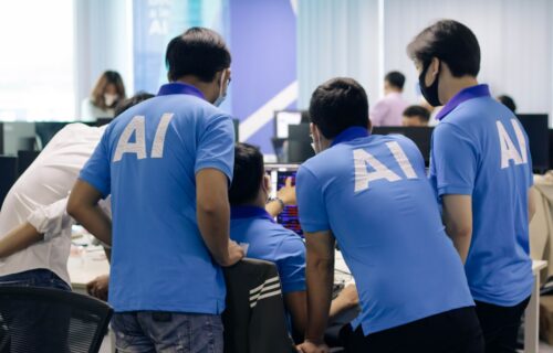 enterprise procurement automation - man in blue nike crew neck t-shirt standing beside man in blue crew neck t