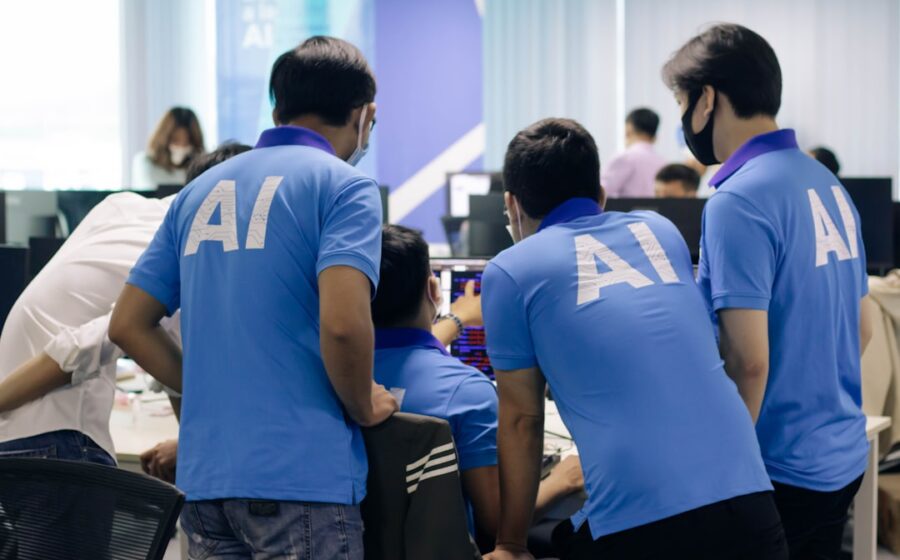 enterprise procurement automation - man in blue nike crew neck t-shirt standing beside man in blue crew neck t