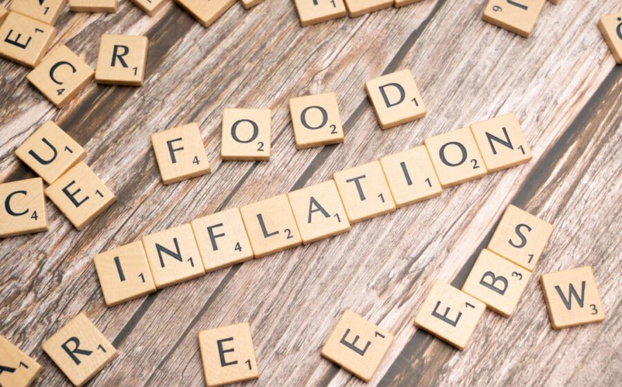 housing crisis solutions - scrabble tiles spelling out food information on a wooden table